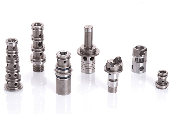 Precision grinding and honing of hydraulic components